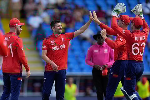 Mark Wood celebrates Kashyap Prajapati's wicket
